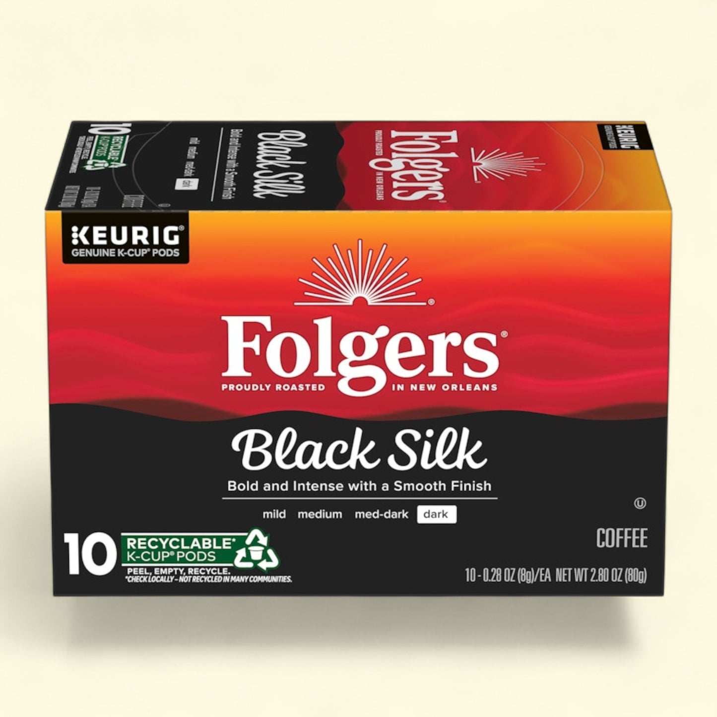 Box of Folgers Black Silk coffee K-Cup pods on a beige background
