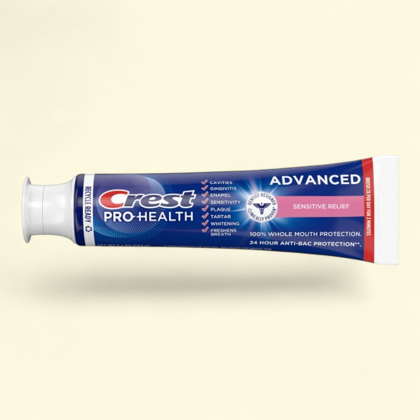 Crest Pro-Health toothpaste tube on a beige background