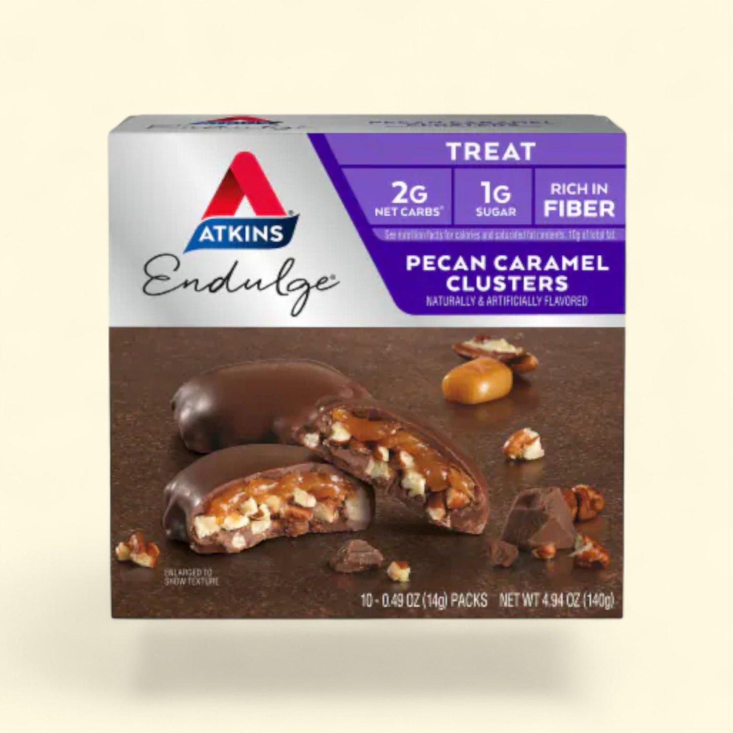 Box of Atkins Endulge Pecan Caramel Clusters on a beige background