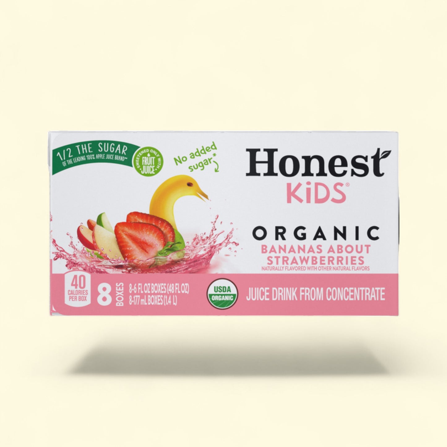 Box of Honest Kids Organic Bananas About Strawberries juice drink on a light yellow background