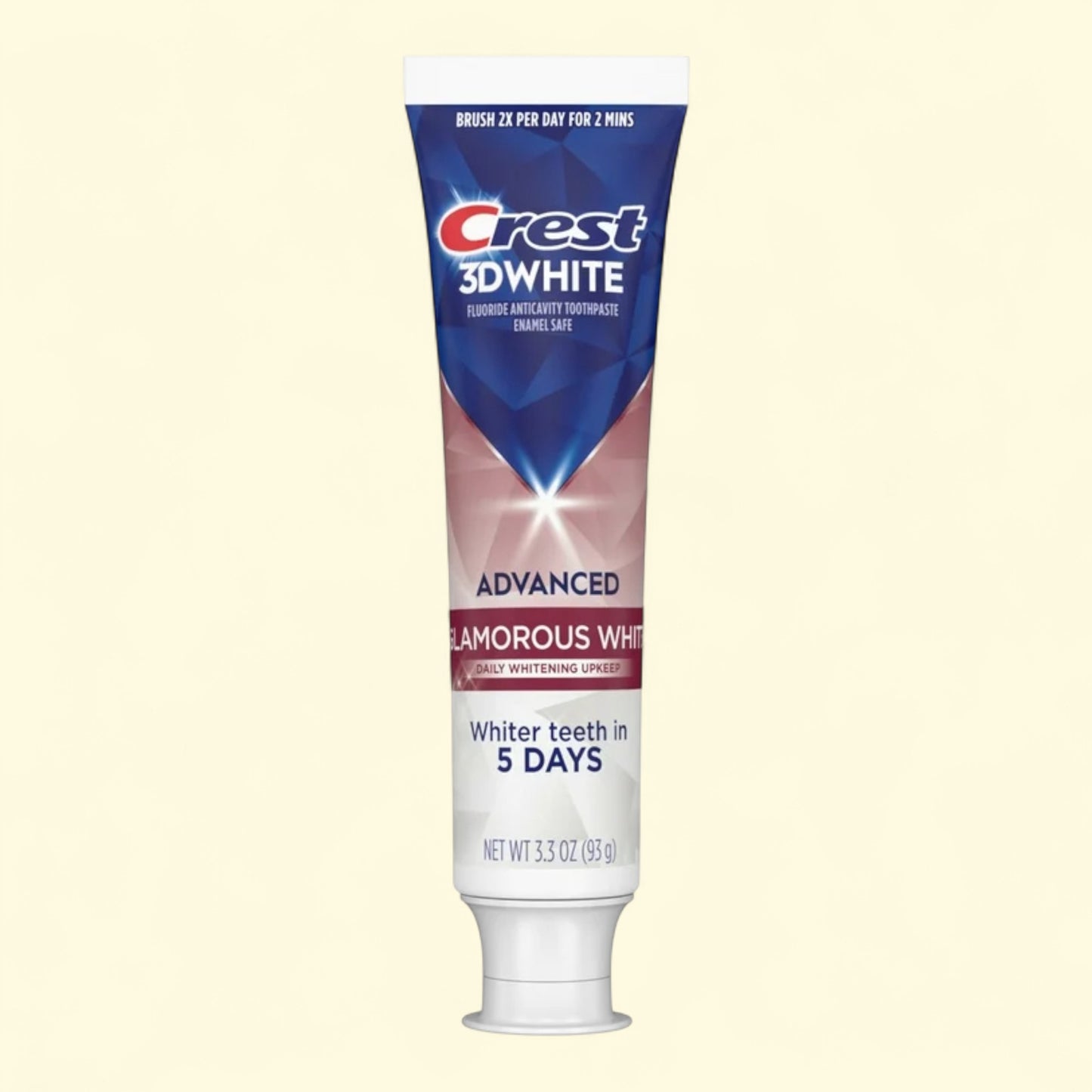 Crest 3D White toothpaste tube on a beige background