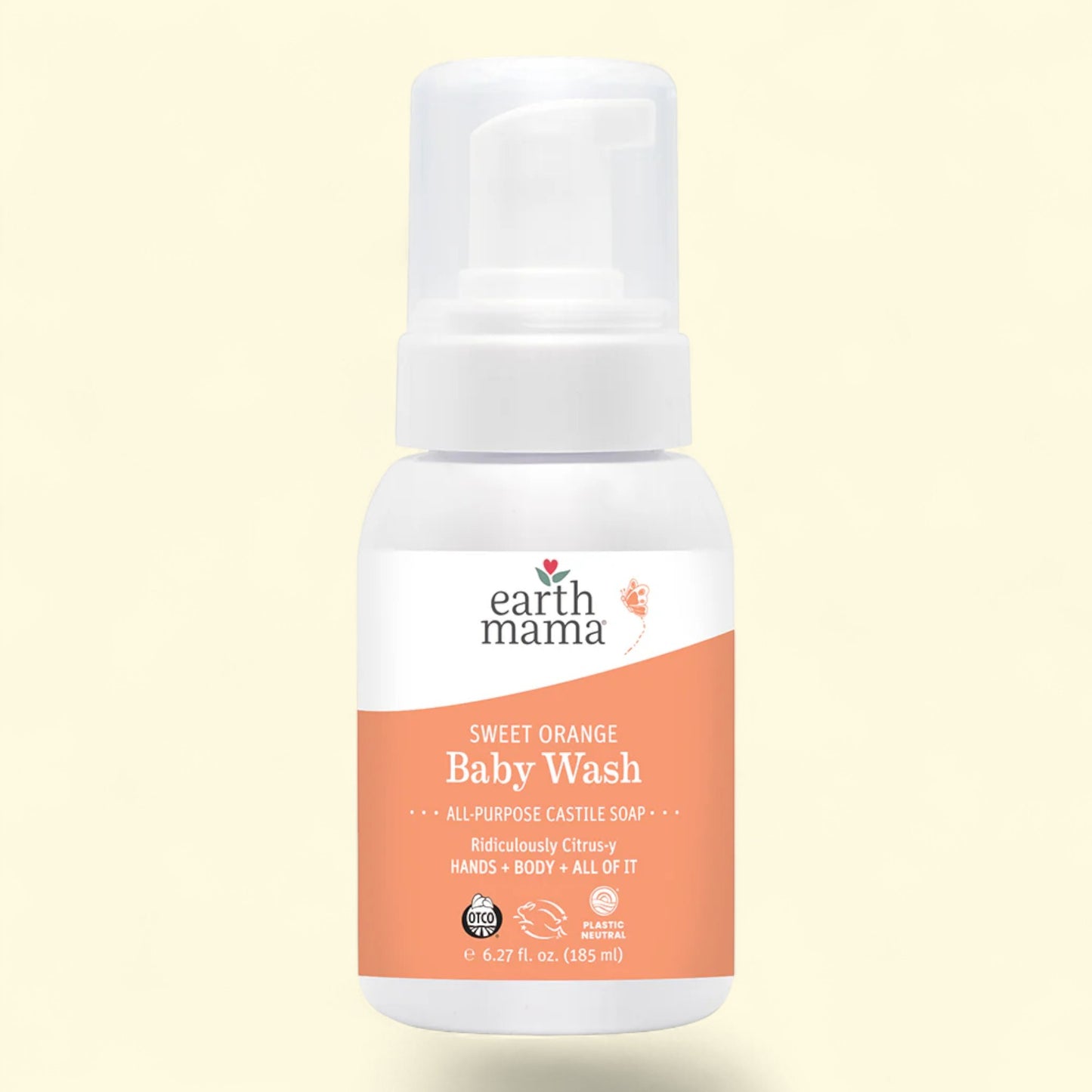 Earth Mama Sweet Orange Baby Wash bottle on a light beige background