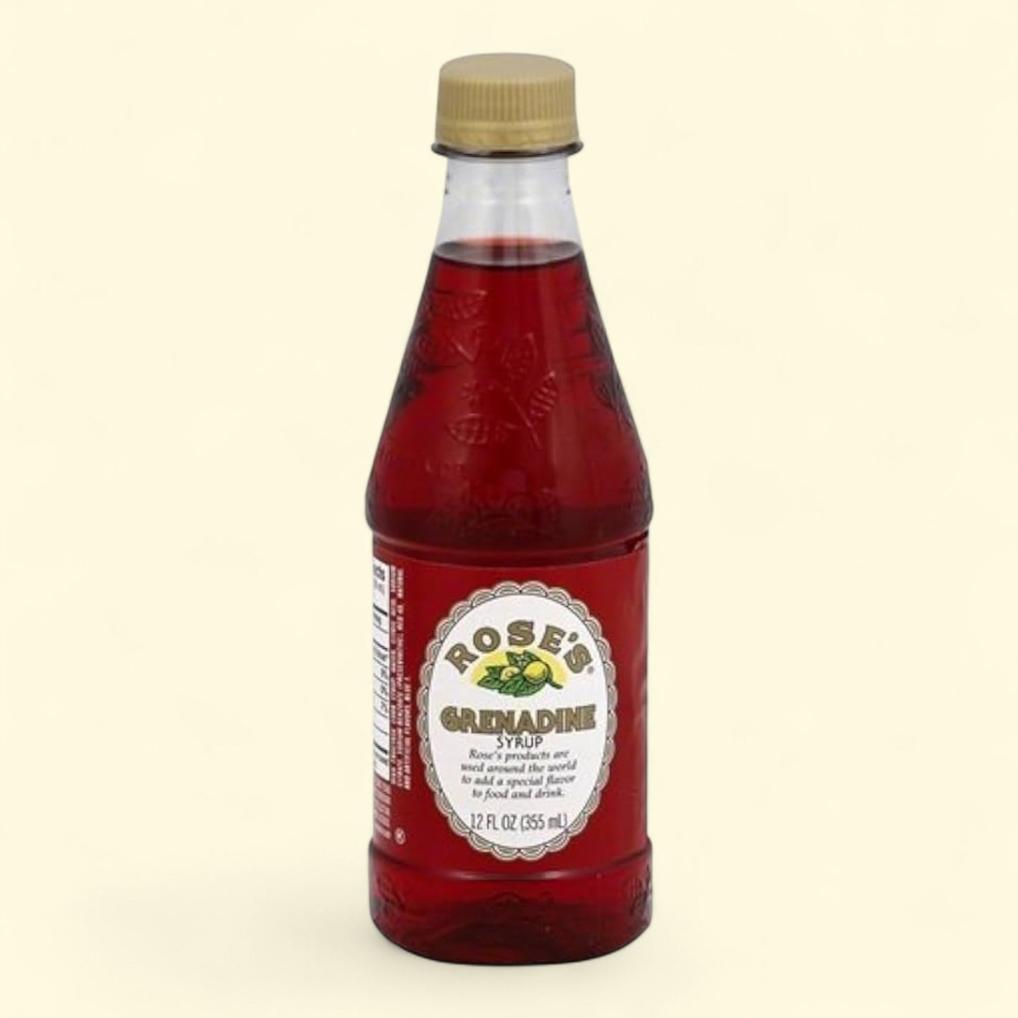 Bottle of Rose's Grenadine Syrup on a beige background