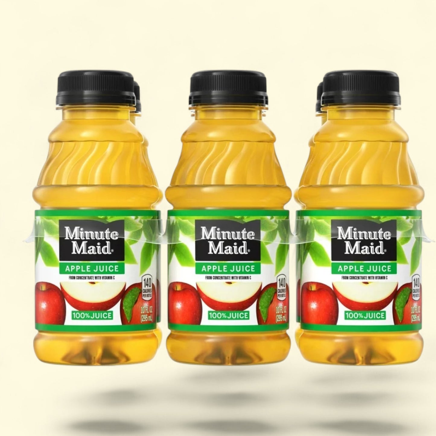 Combo Three bottles of Minute Maid apple juice on a beige background