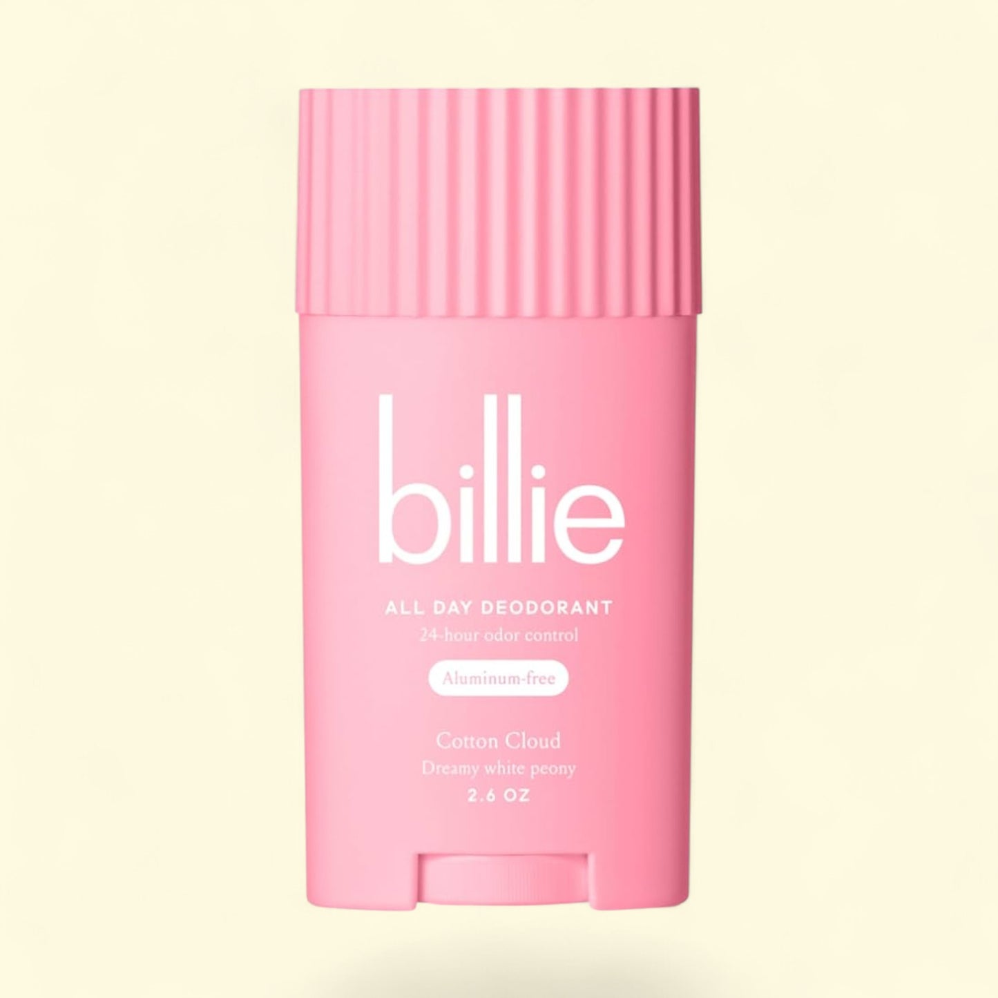 Pink 'billie' deodorant stick on a light beige background