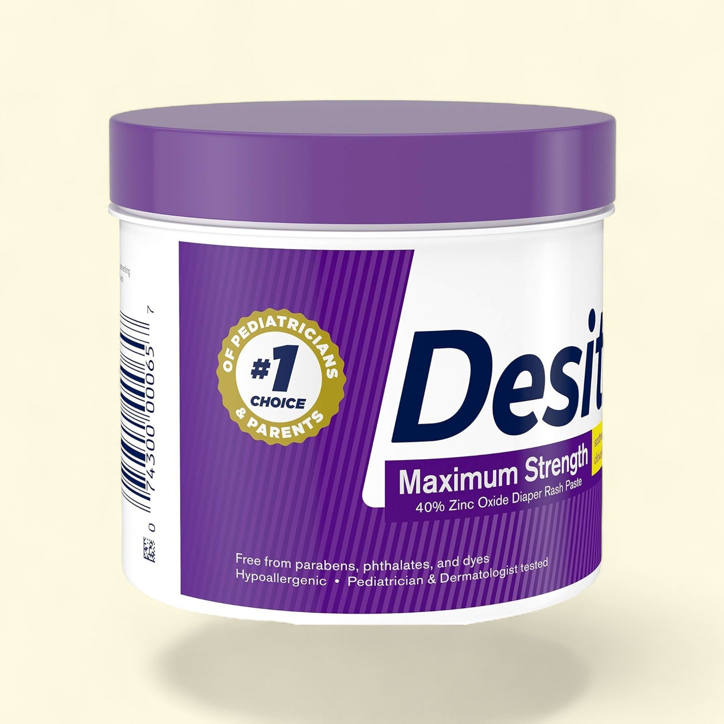 Desitin Maximum Strength diaper rash cream jar with purple lid on a beige background