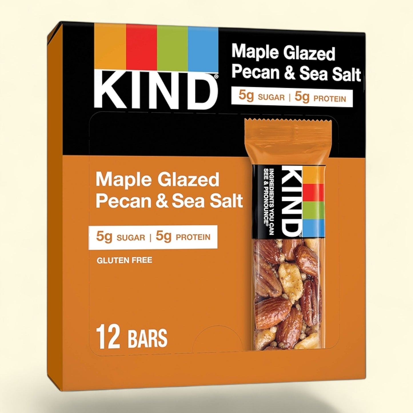 Kind Maple Glazed Pecan & Sea Salt bars on a beige background