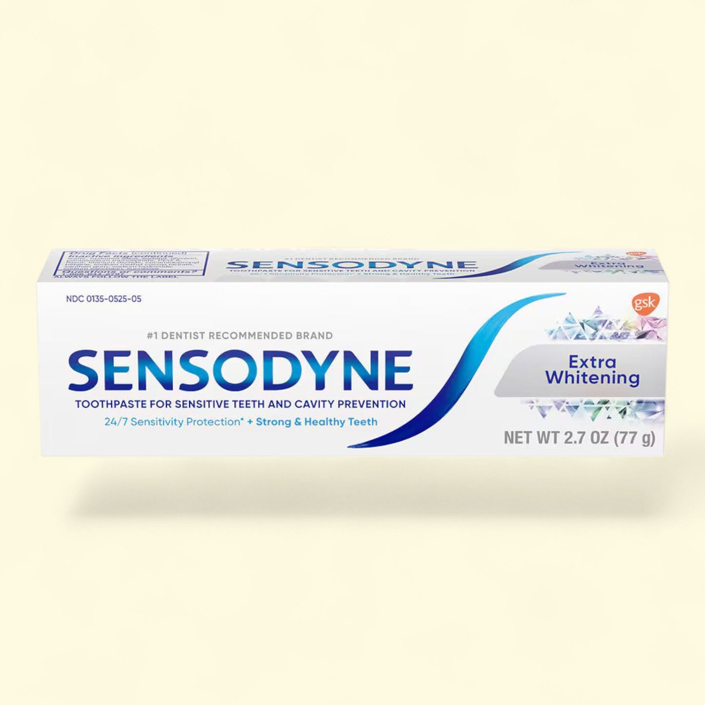 Sensodyne Extra Whitening toothpaste tube on a beige background
