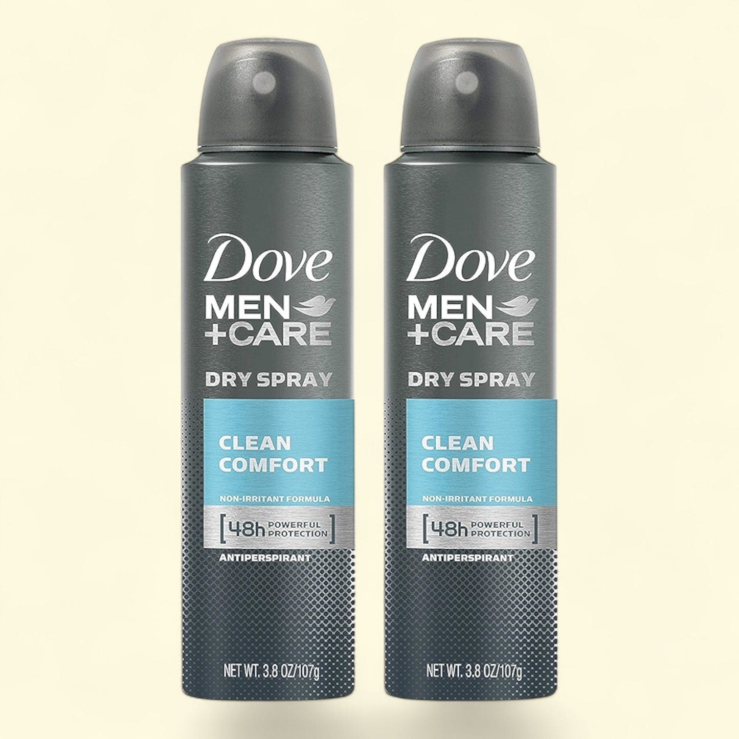 Two bottles of Dove Men+Care Dry Spray on a beige background