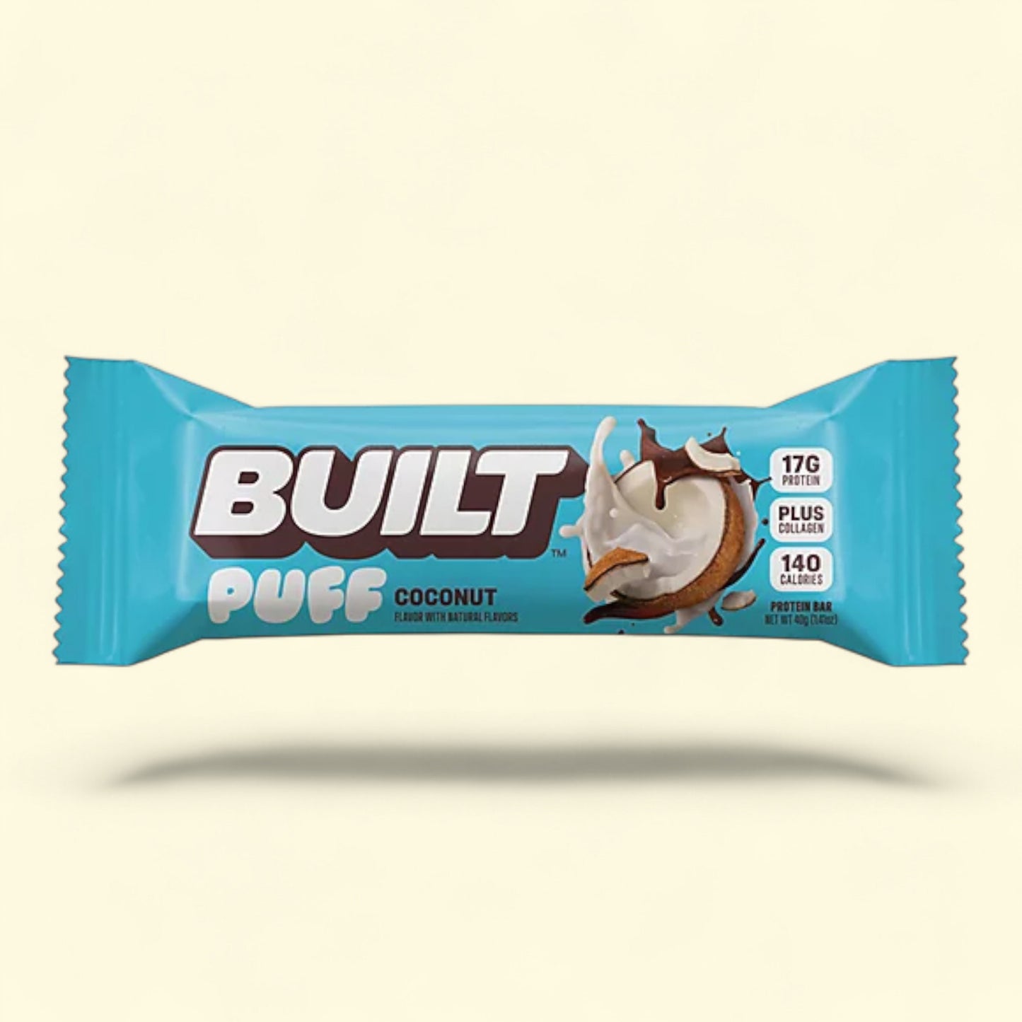 Built Puff Coconut protein bar packaging on a beige background