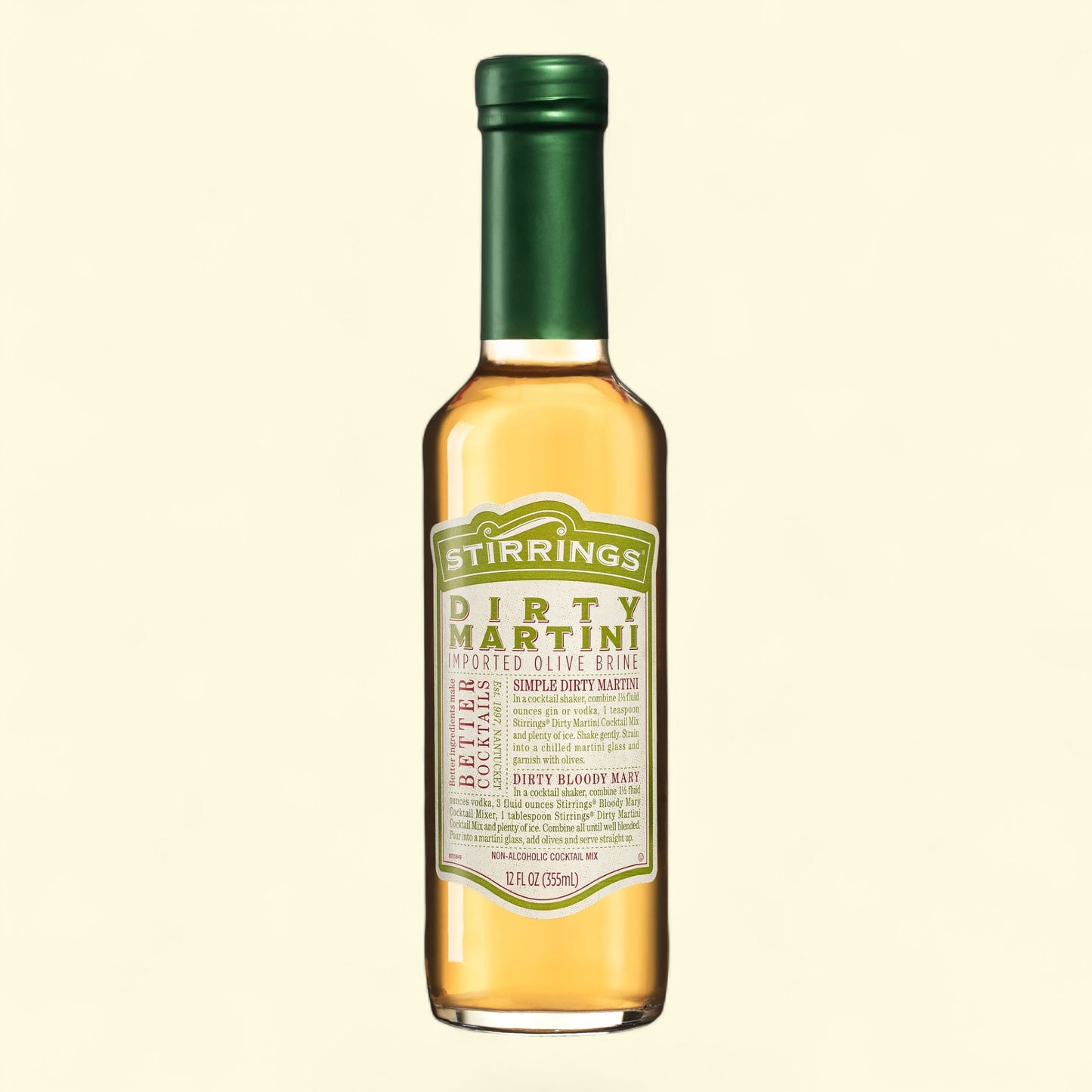 Bottle of Stirrings Dirty Martini mixer on a beige background
