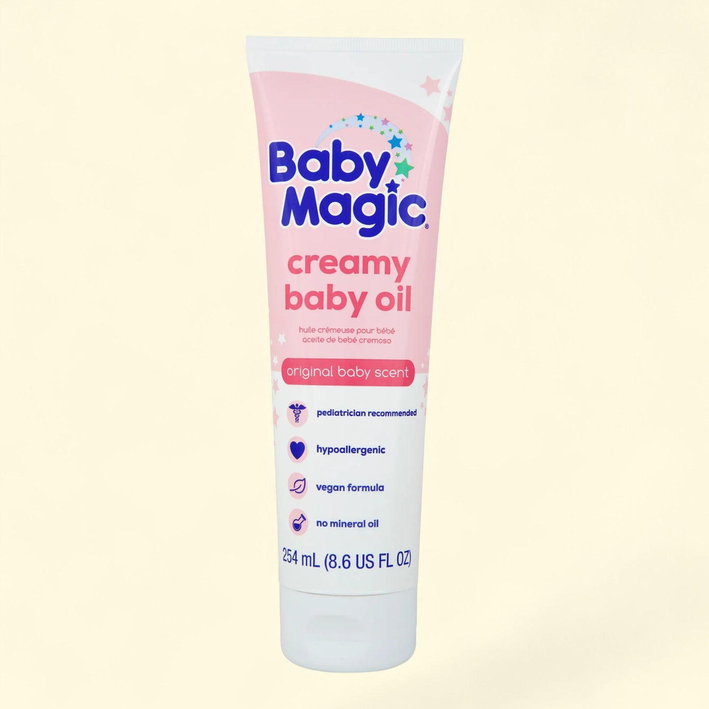 Baby Magic creamy baby oil tube on a light yellow background
