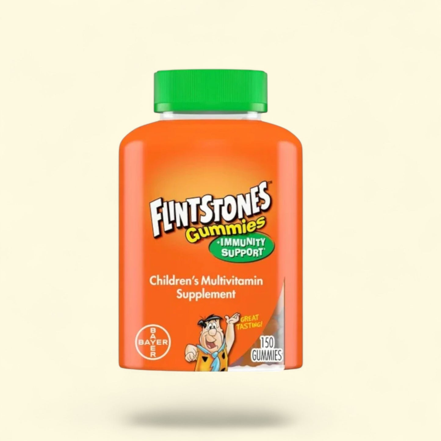 Flintstones gummies children's multivitamin supplement bottle on a beige background