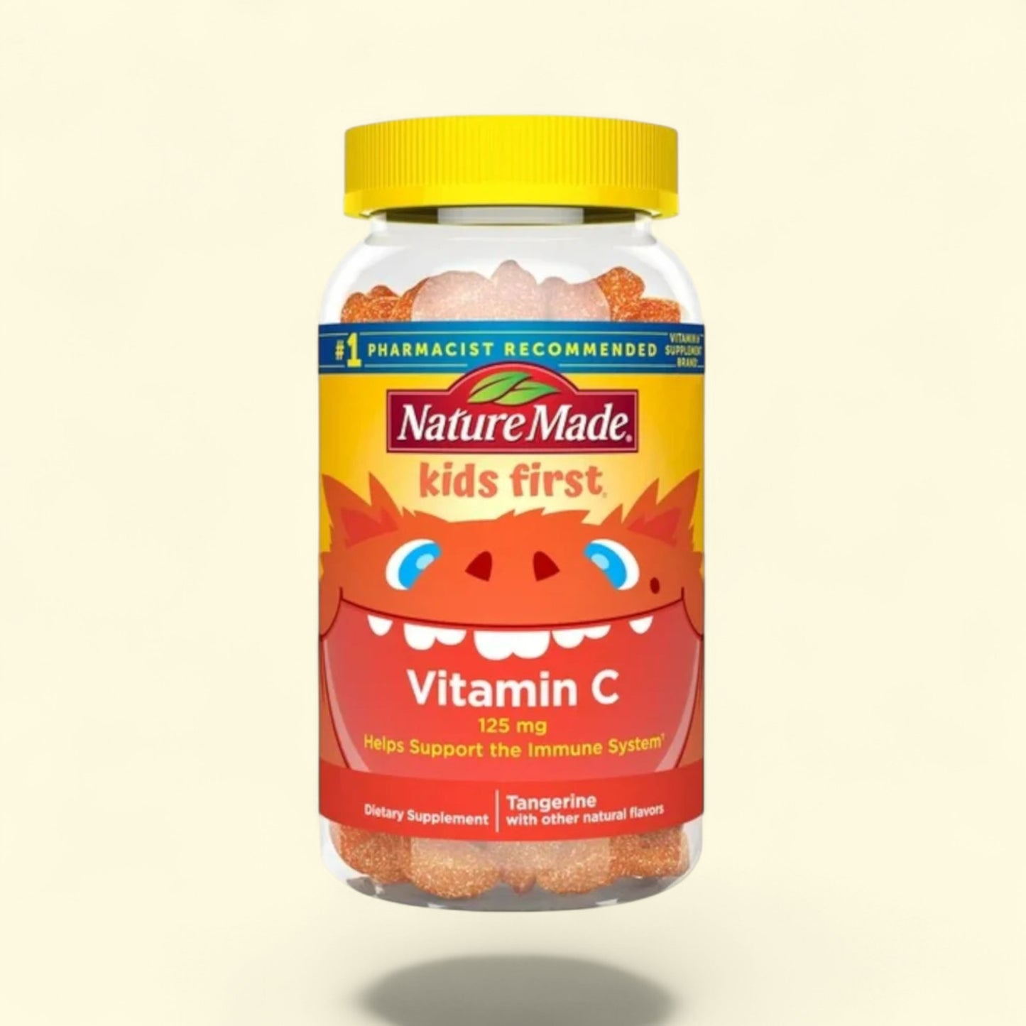 Nature Made Kids First Vitamin C supplement bottle with a yellow lid on a beige background