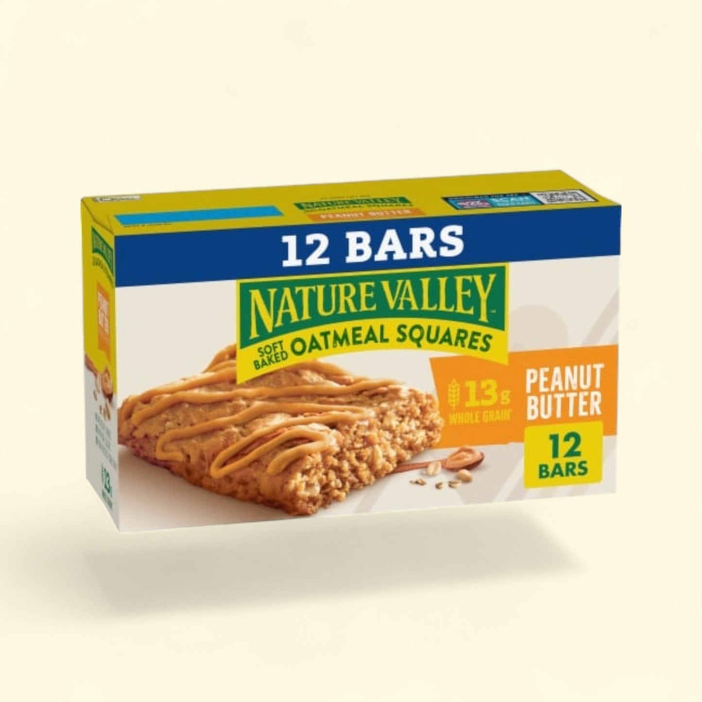Box of Nature Valley Oatmeal Squares Peanut Butter bars on a beige background
