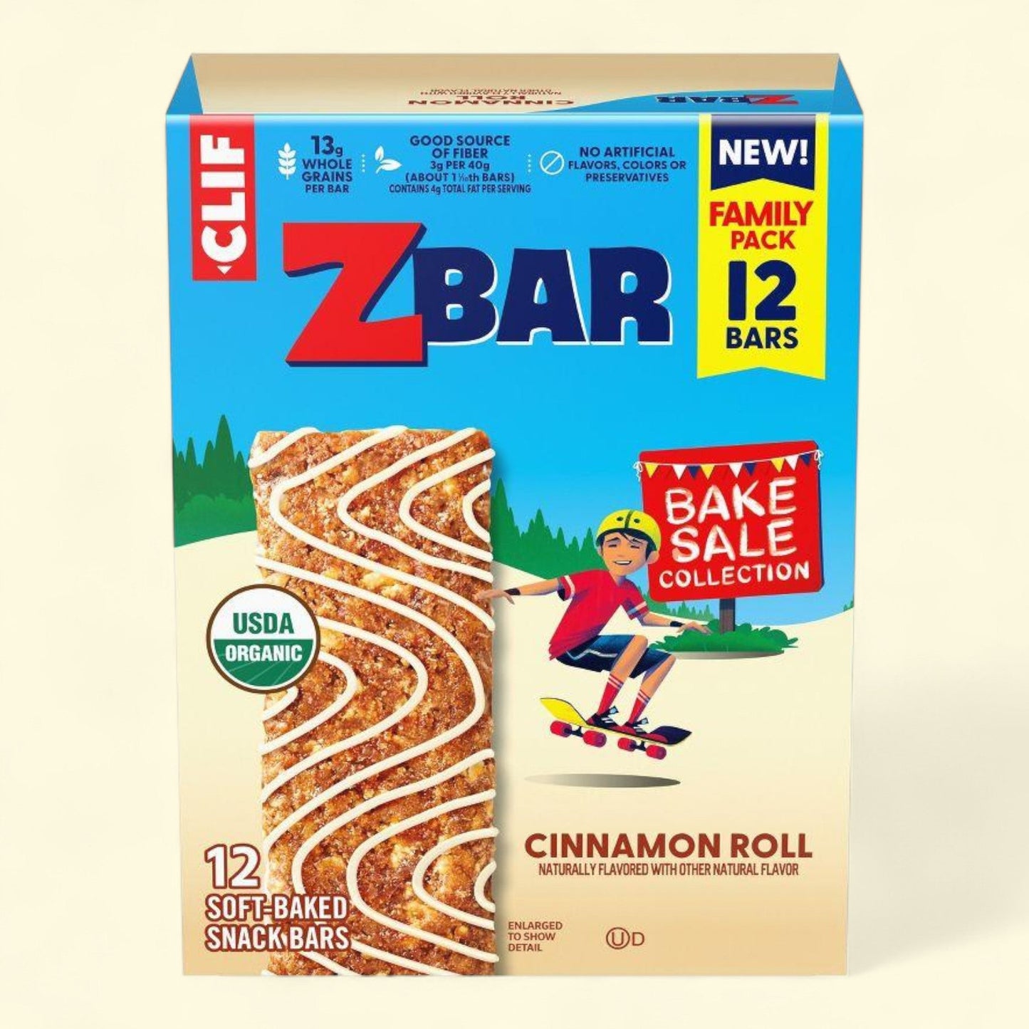 Box of Clif ZBar Cinnamon Roll snack bars with a child on a skateboard illustration.