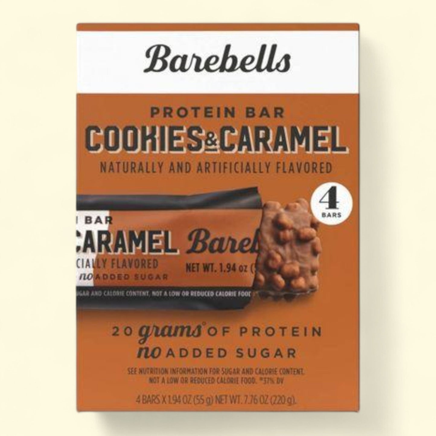 Box of Barebells Cookies & Caramel protein bars on a beige background