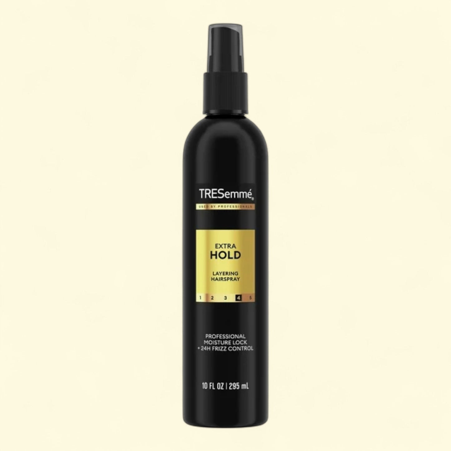 TRESemmé Extra Hold layering hairspray bottle on a black background