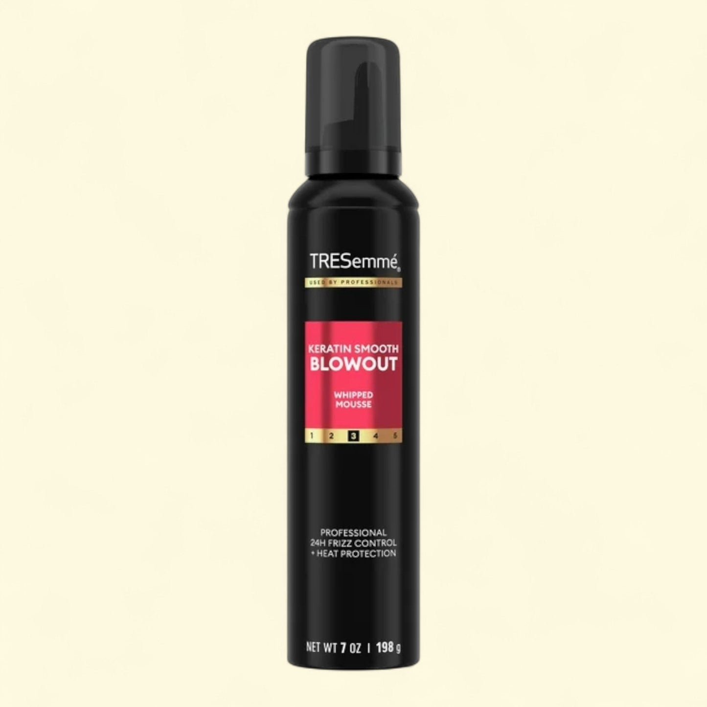 TRESemme Keratin Smooth Blowout whipped mousse bottle on a black background