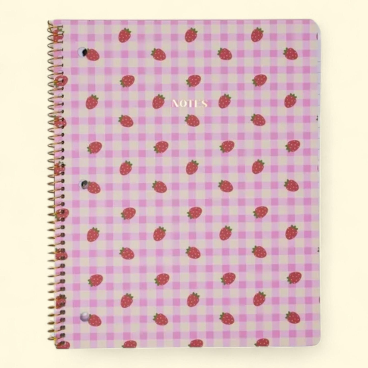 Notebook with strawberry pattern on a pink and white checkered background