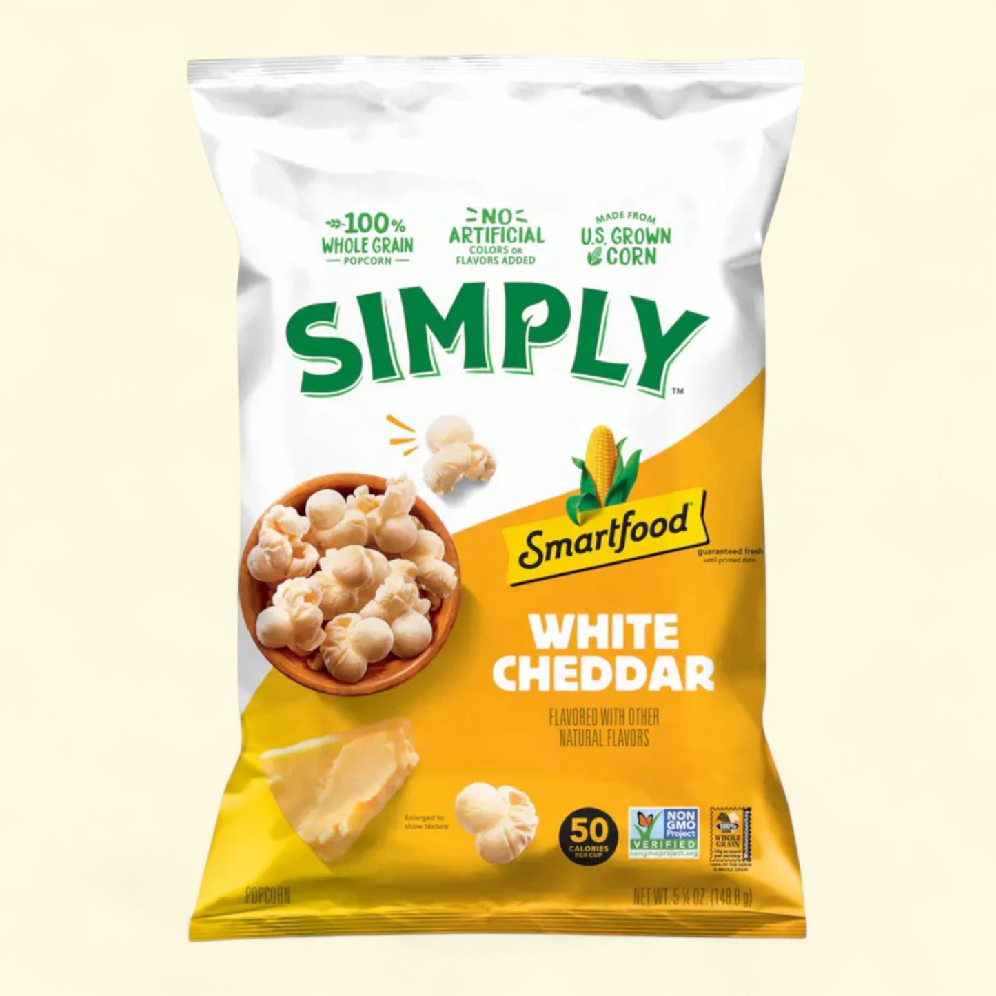 Simply Smartfood White Cheddar popcorn on a light yellow background