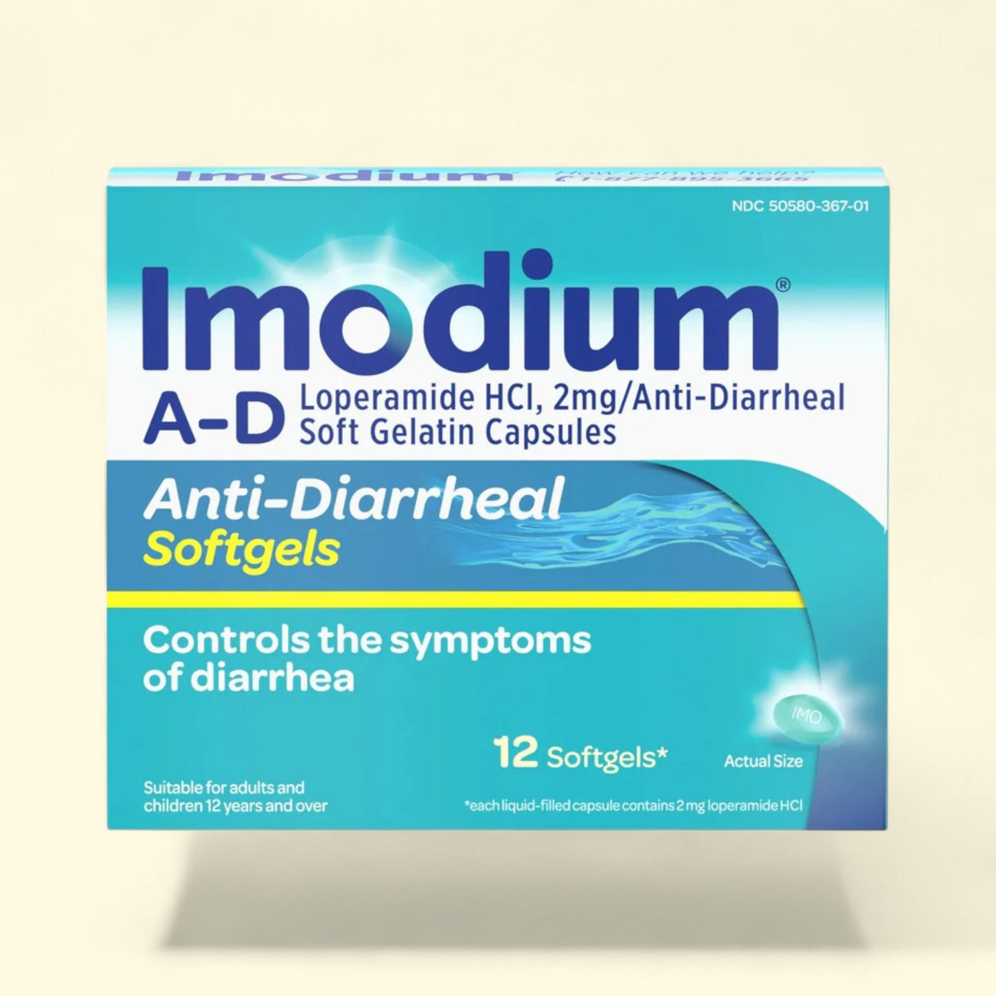 Imodium A-D anti-diarrheal softgels packaging on a beige background
