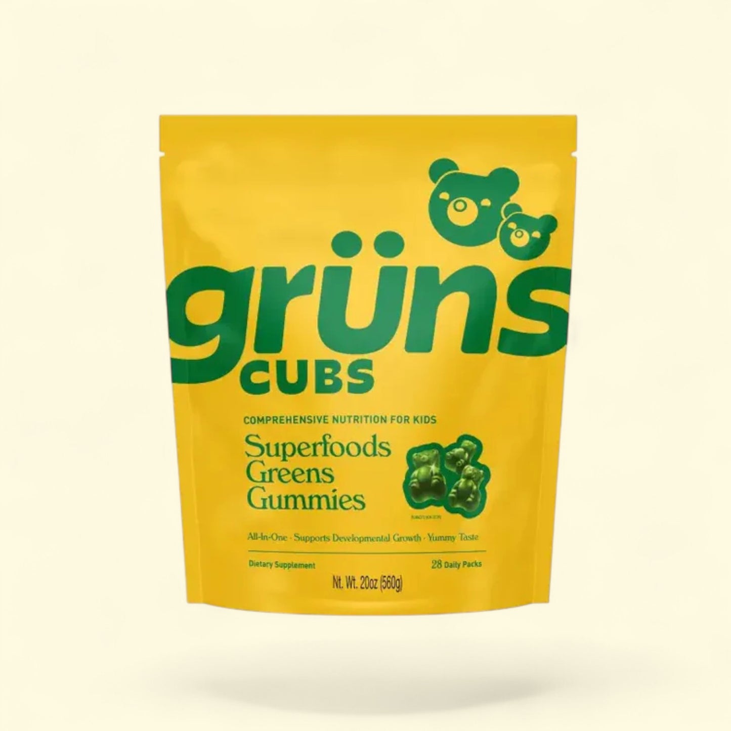 Yellow package of grüns Cubs Superfoods Greens Gummies on a beige background
