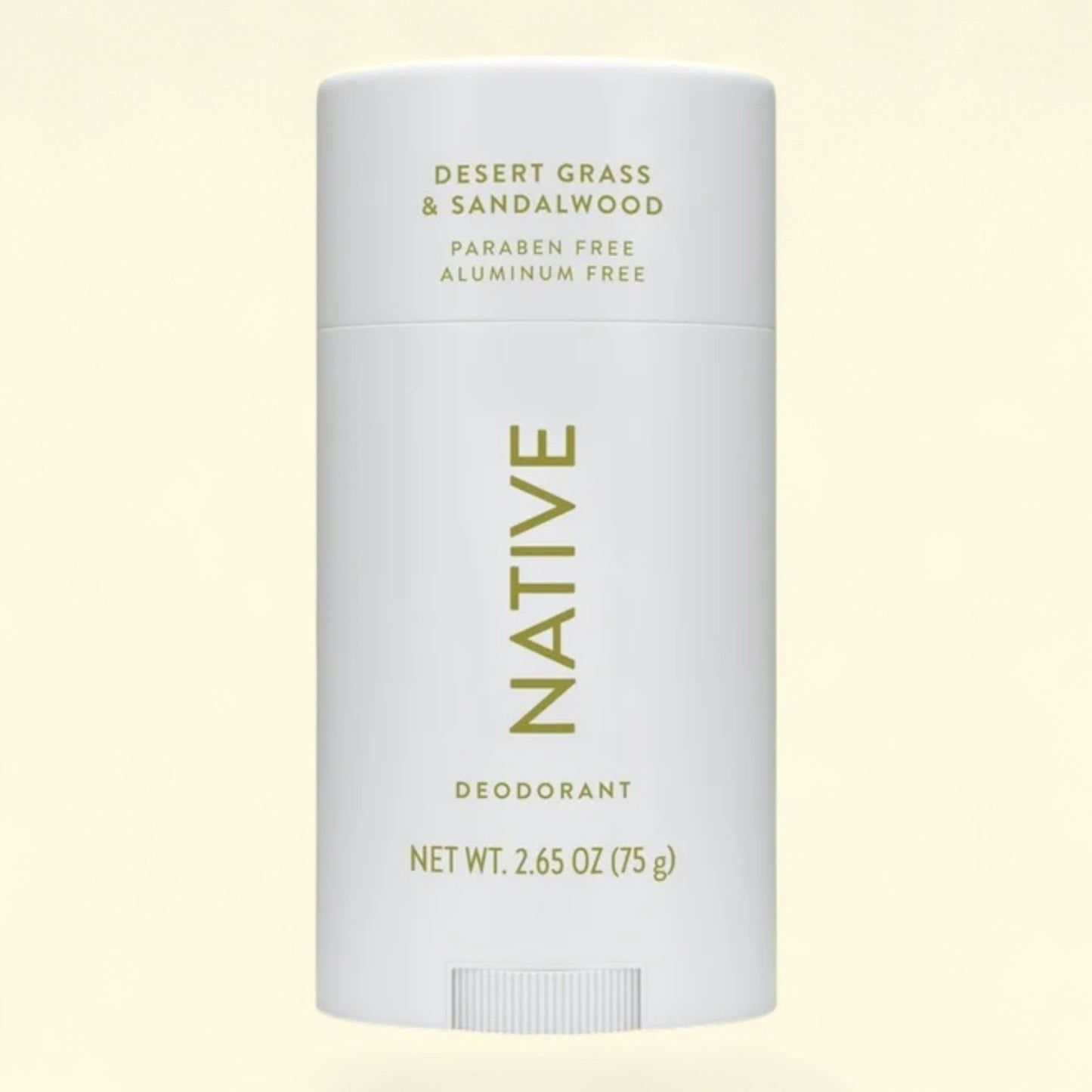 Native deodorant stick on a light yellow background