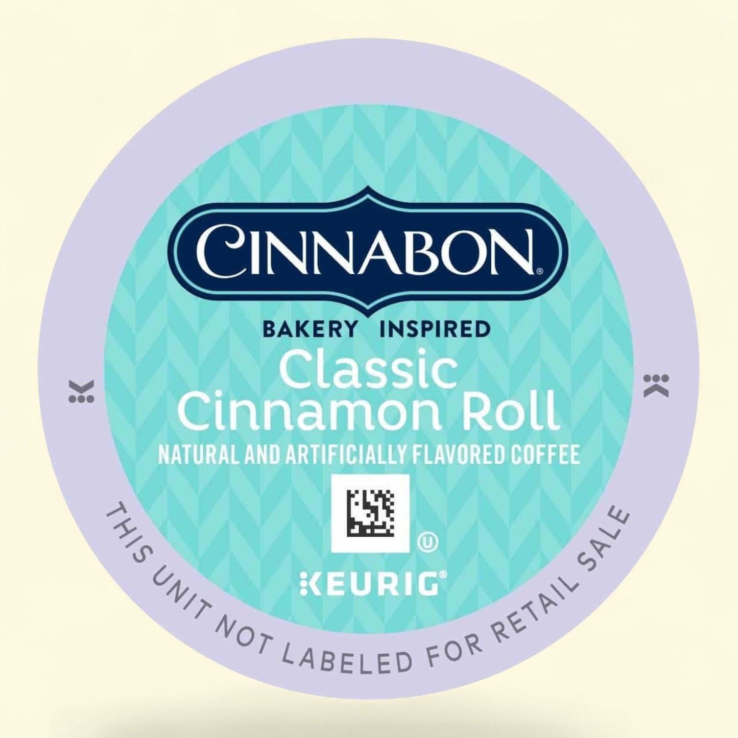 Cinnabon Classic cinnamon roll natural and artificially coffee pod with Keurig branding on a light yellow background