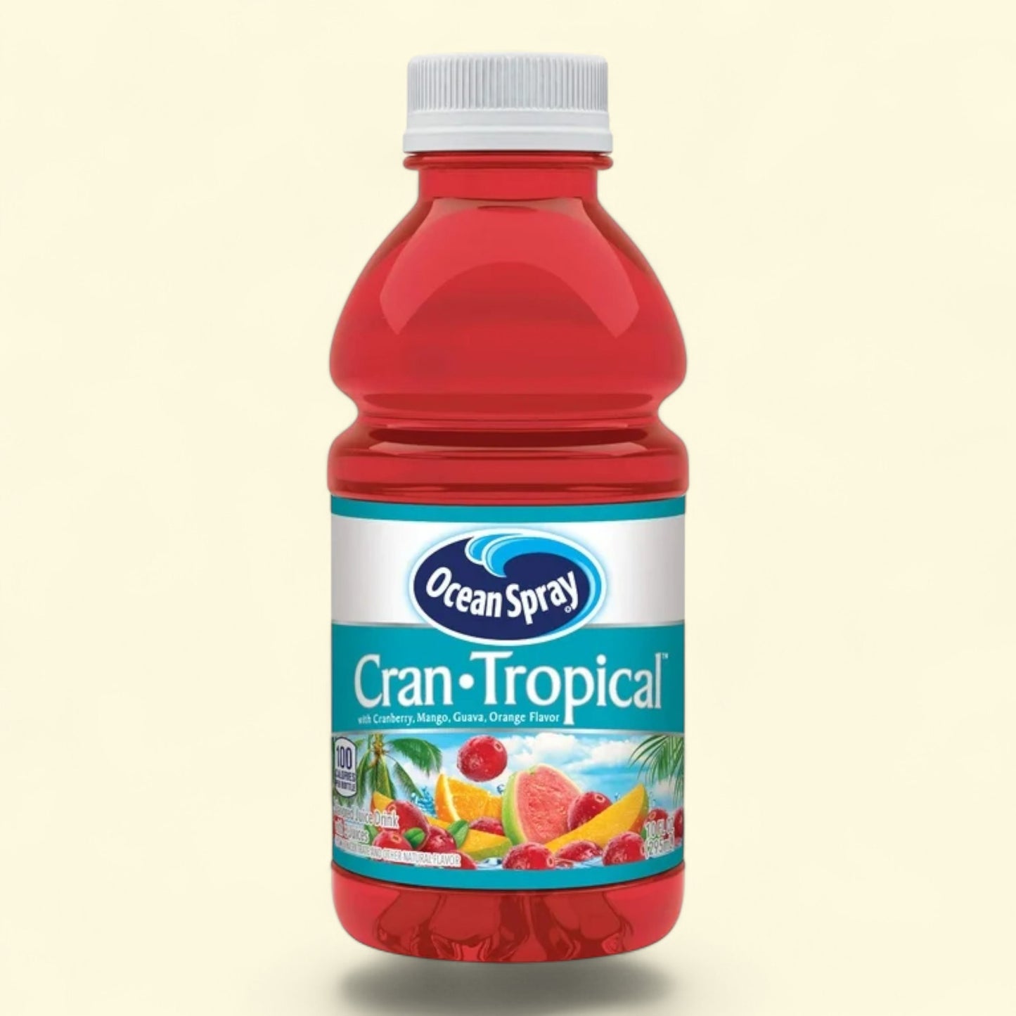 Red bottle of Ocean Spray Cran-Tropical juice on a beige background