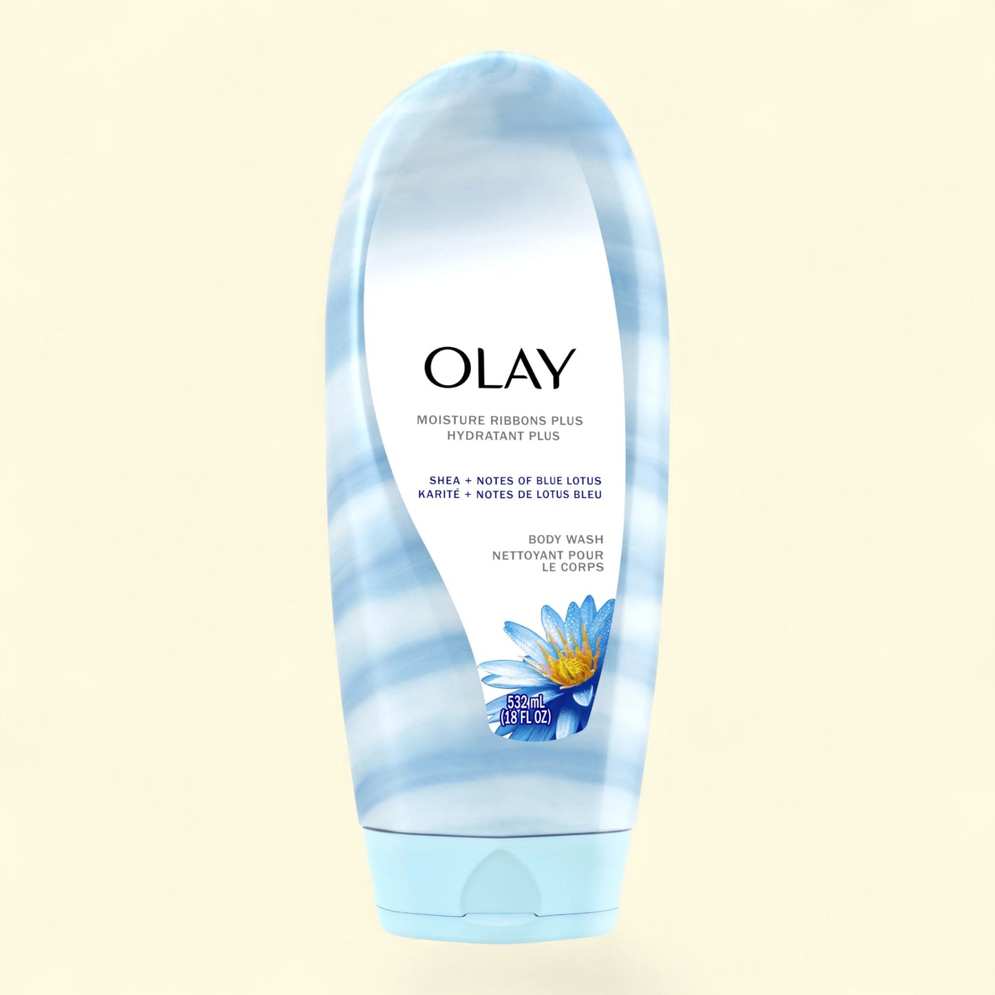 Olay body wash tube with blue floral design on a beige background