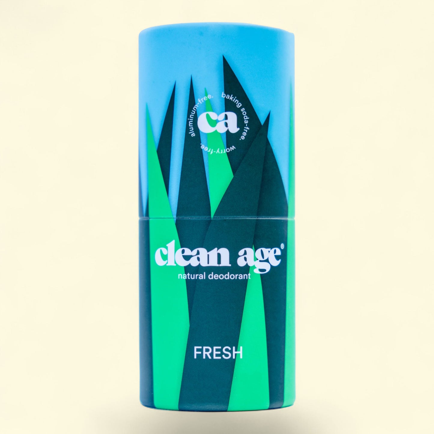 Blue and green deodorant container with 'clean age' branding on a beige background
