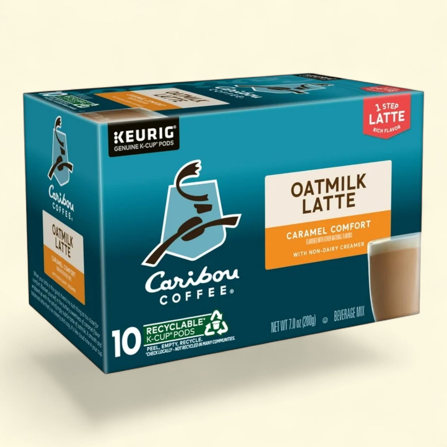 Box of Caribou Coffee Oatmilk Latte caramel comfort K-Cup pods on a beige background