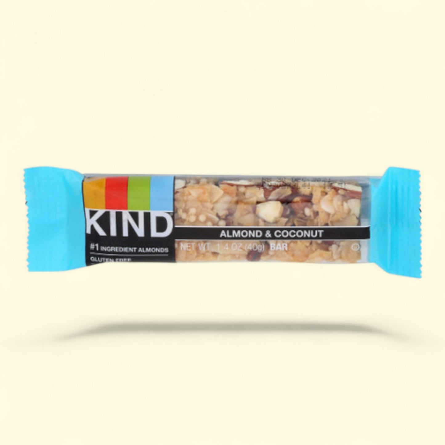 Kind almond and coconut bar on a beige background