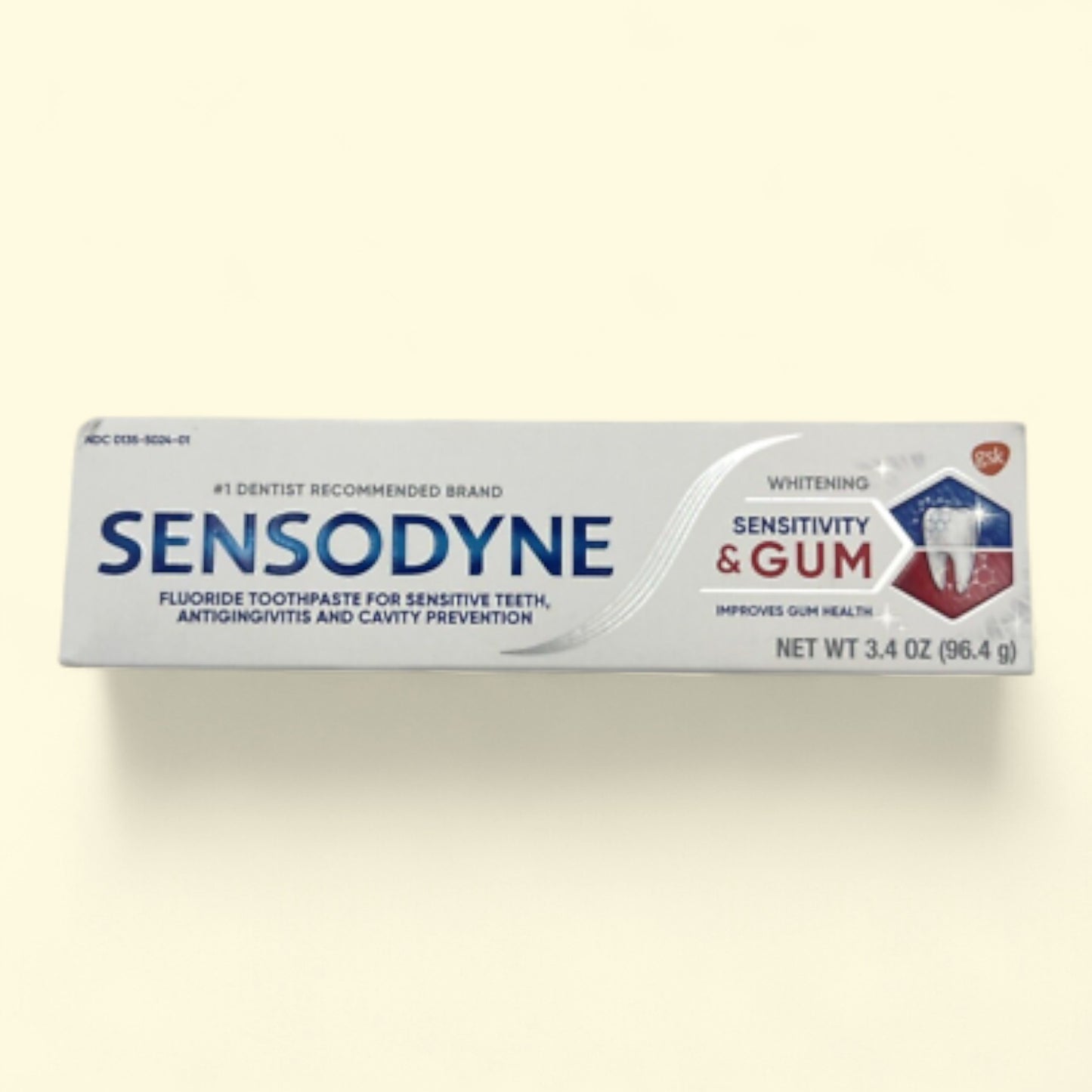Sensodyne toothpaste tube on a white background