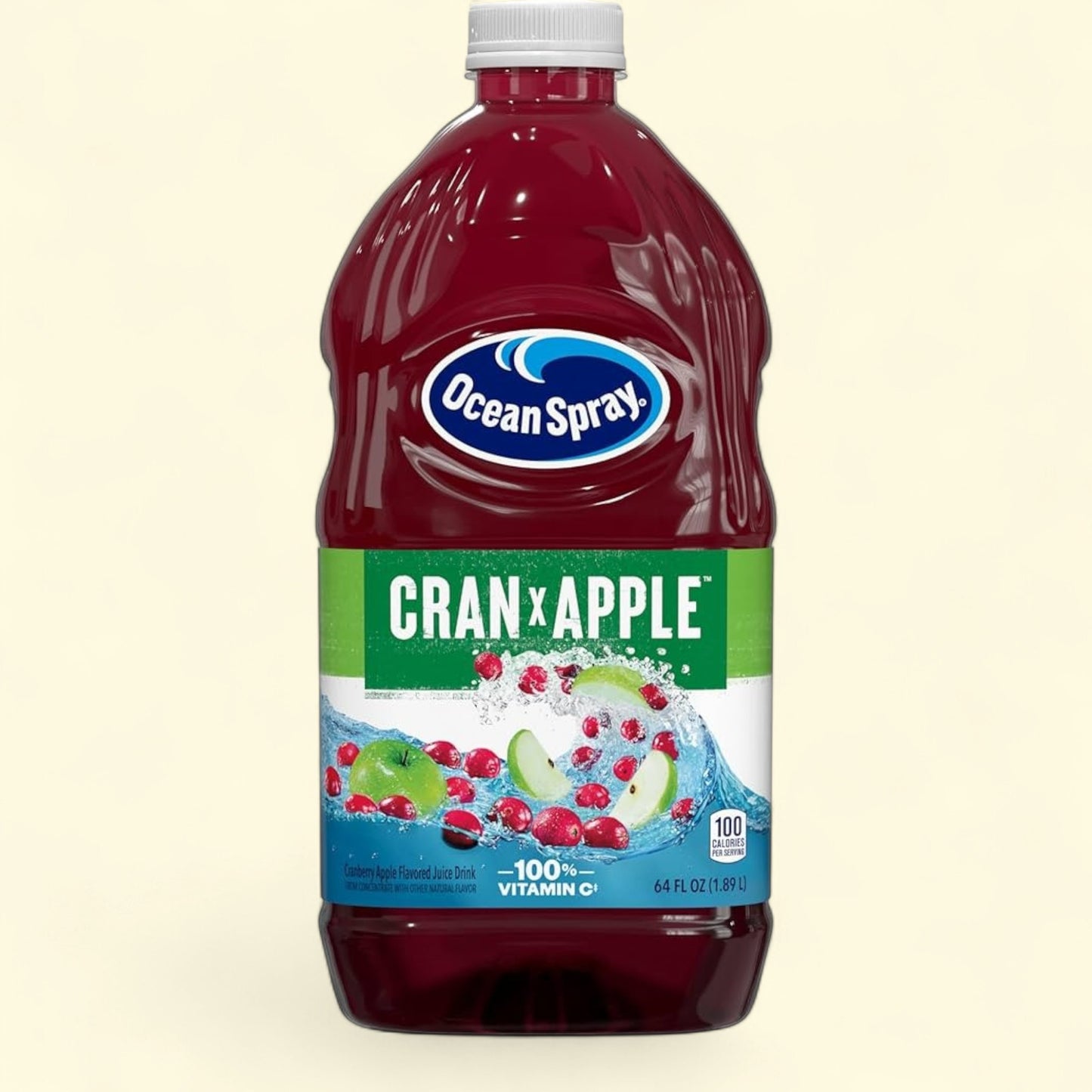 Treatspree Ocean Spray Cran-Apple Juice bottle, 64 fl oz, with cranberries and apple slices splashing in water.