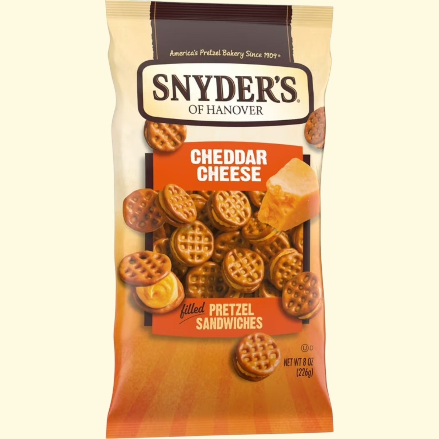 Treatspree Snyder's of Hanover Cheddar Cheese Filled Pretzel Sandwiches, 8 oz bag. Crunchy pretzel shells filled with creamy cheddar cheese.