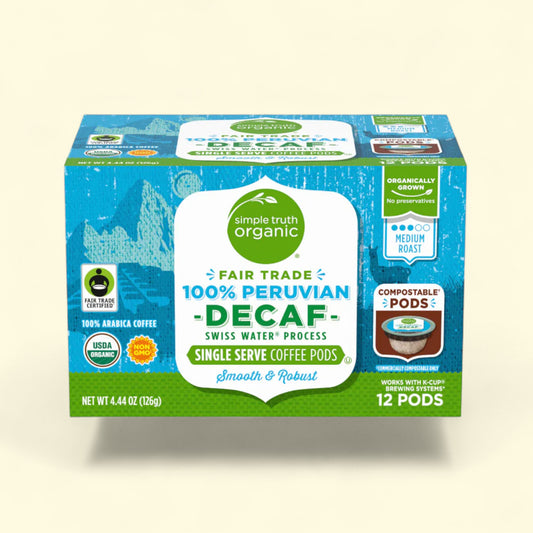 Box of Simple Truth Organic Fair Trade 100% Peruvian Decaf swiss water process single serve coffee pods on a beige background