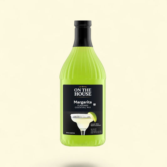 Bottle of 'On The House' margarita cocktail mix on a light beige background