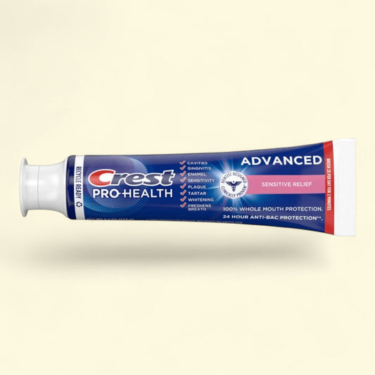 Crest Pro-Health toothpaste tube on a beige background