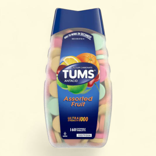 TUMS Assorted Fruit antacid packaging on a beige background