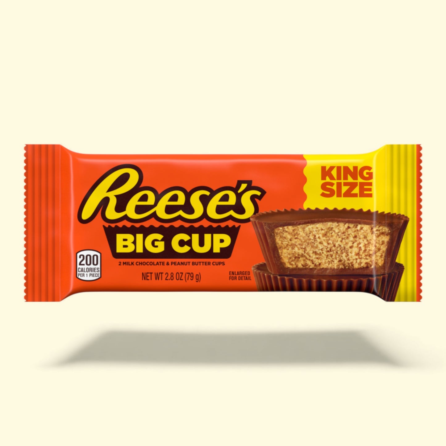Reese's Big Cup King Size candy bar packaging on a beige background