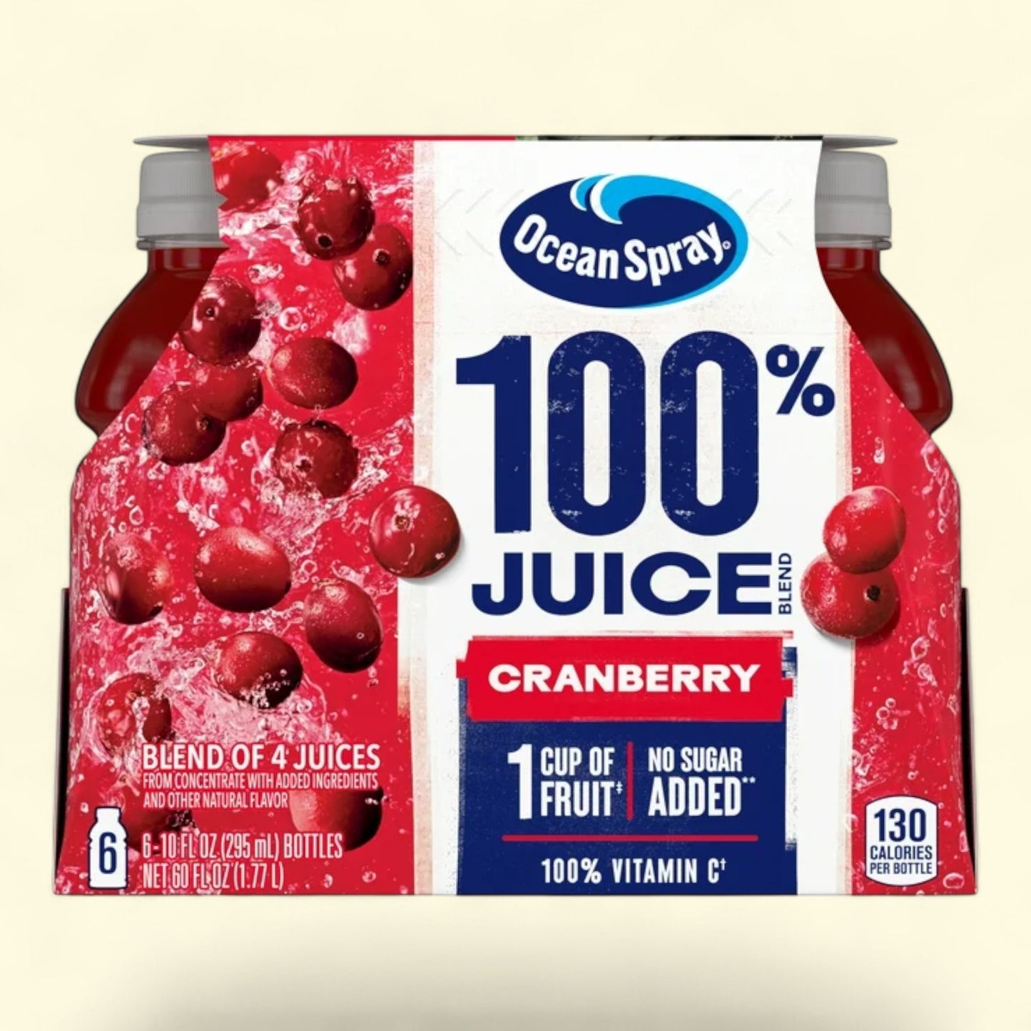 Ocean Spray cranberry juice box with cranberries on a beige background