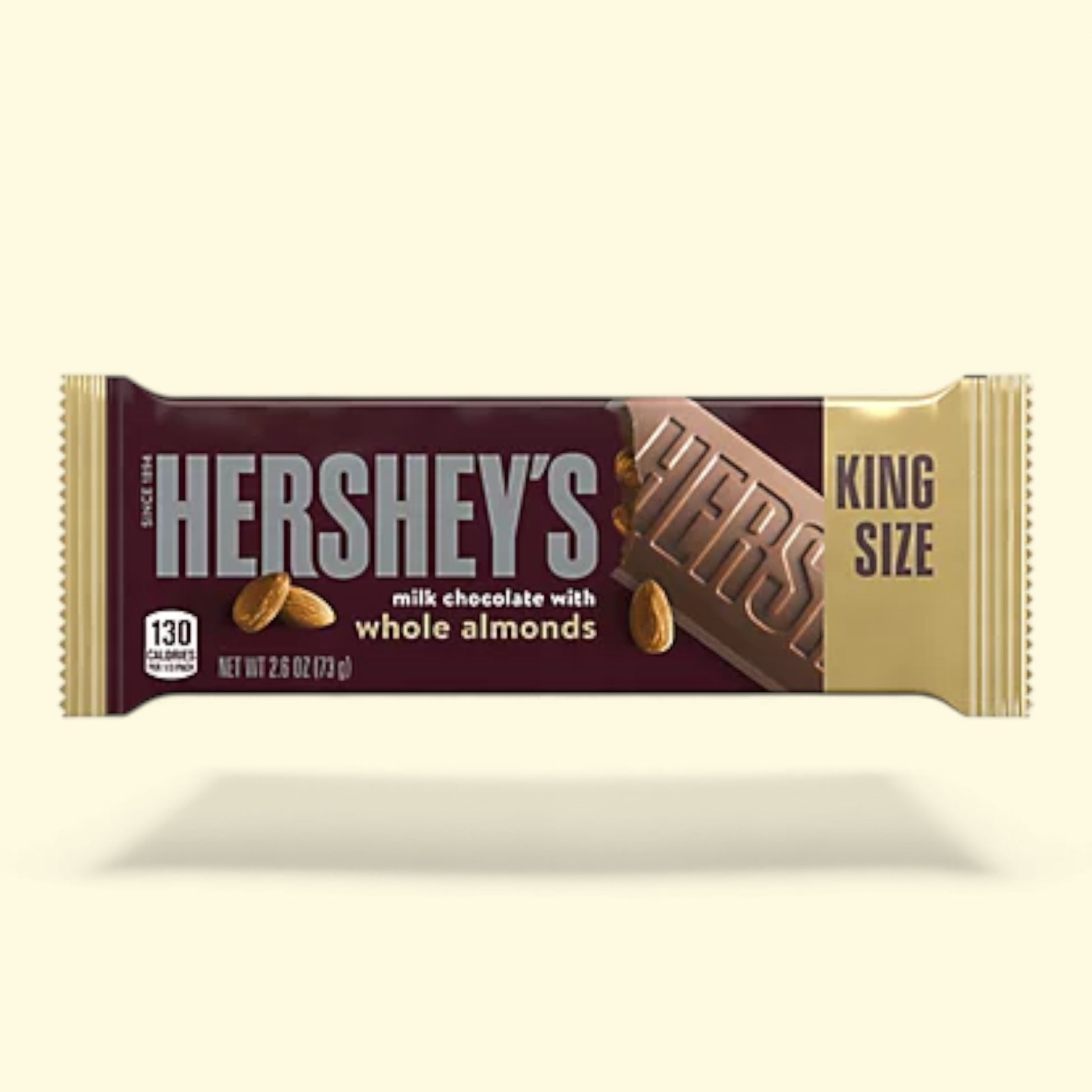 Hershey's chocolate bar with whole almonds packaging on a beige background