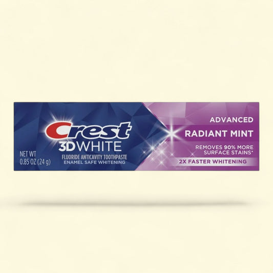 Crest 3D White toothpaste tube on a beige background