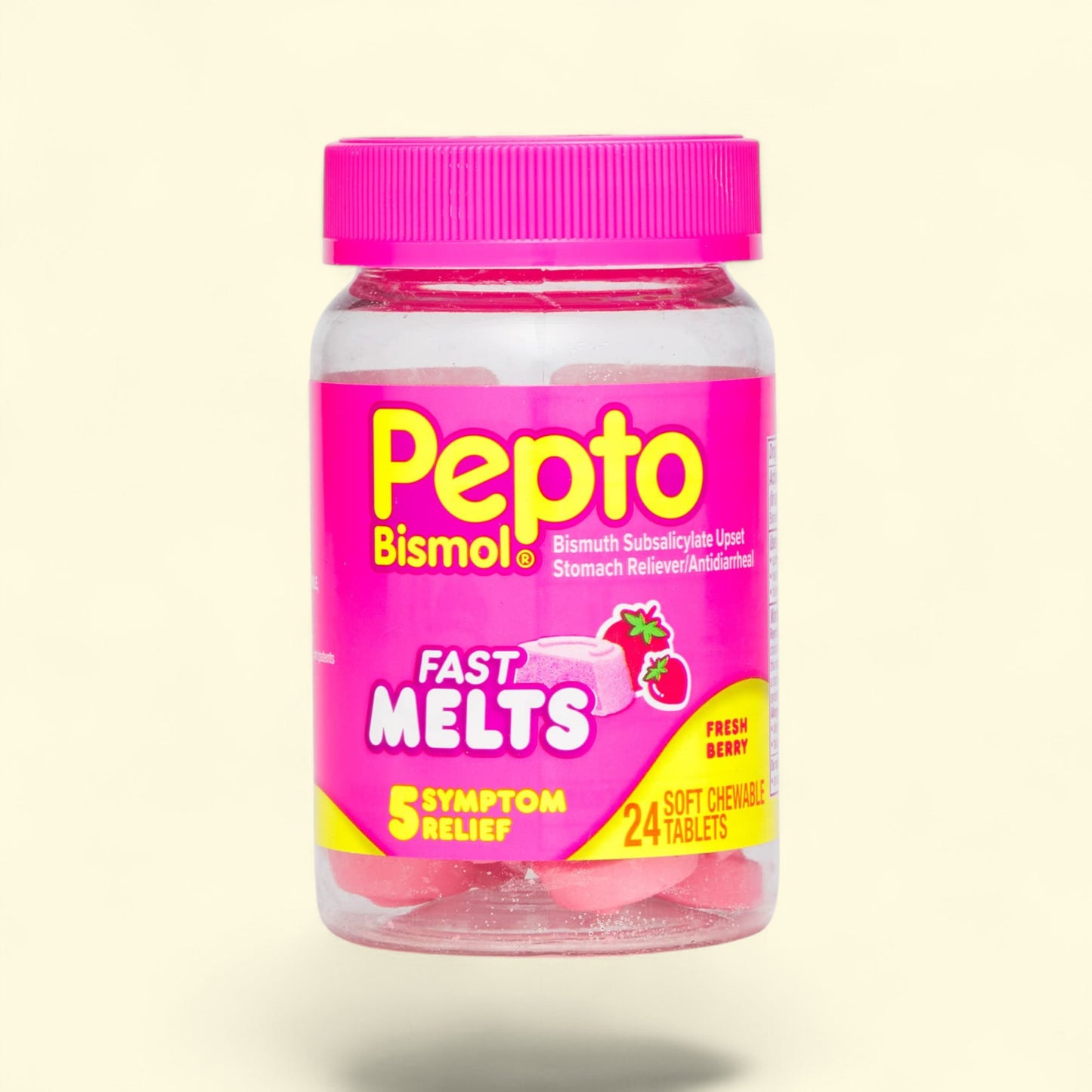 Pepto-Bismol Fast Melts jar with pink lid and label on a beige background