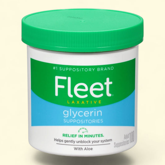 Fleet laxative glycerin suppositories container with green lid on a beige background