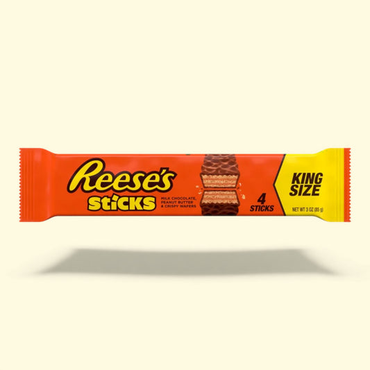 Reese's Sticks candy package on a beige background