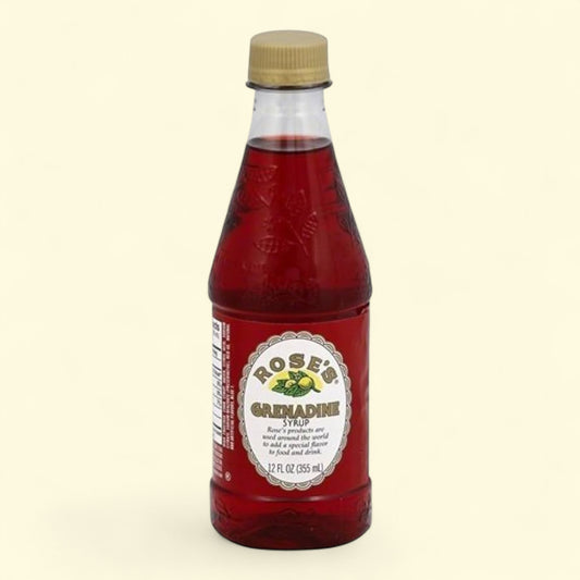 Bottle of Rose's Grenadine Syrup on a beige background