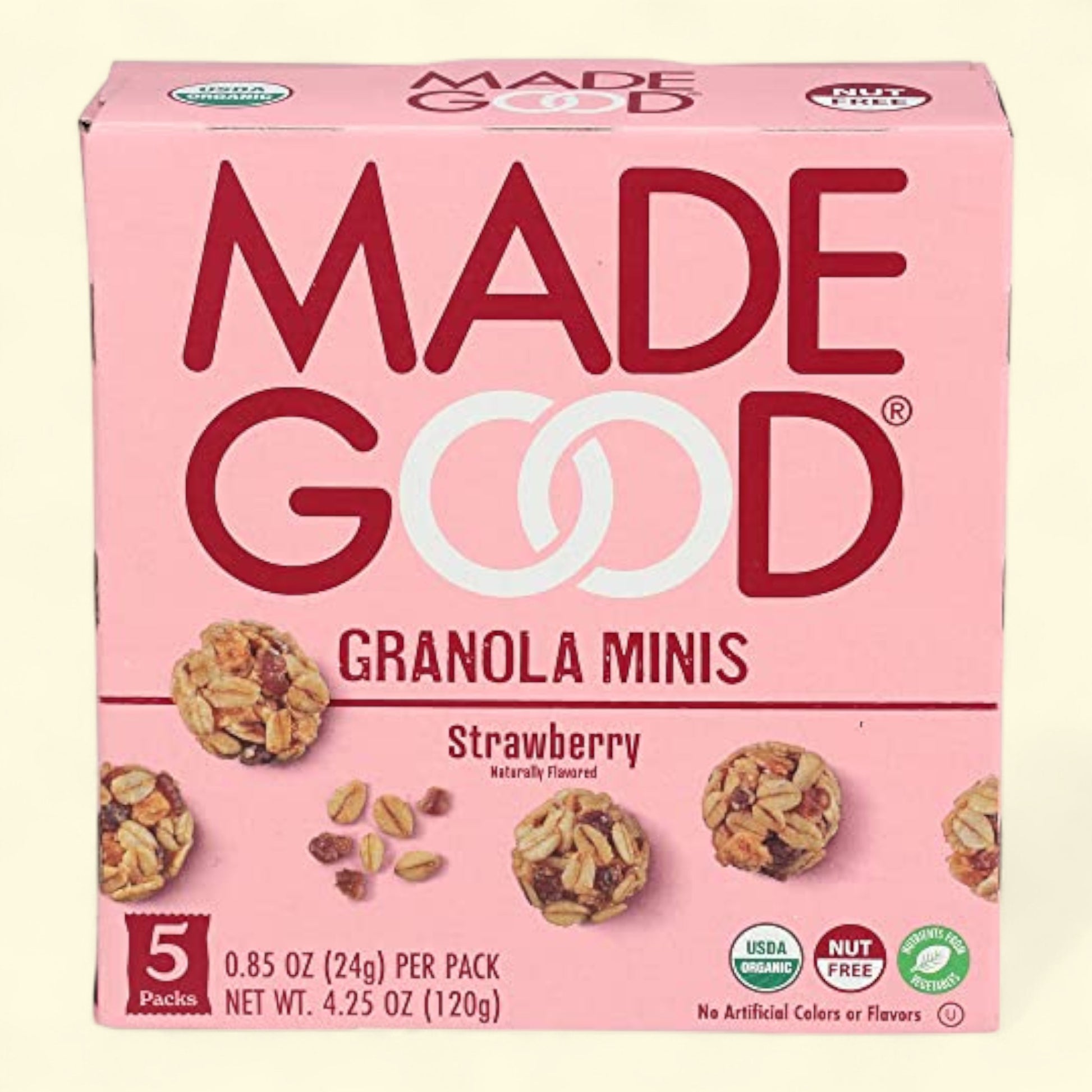 Made Good Strawberry Granola Minis on a light pink background